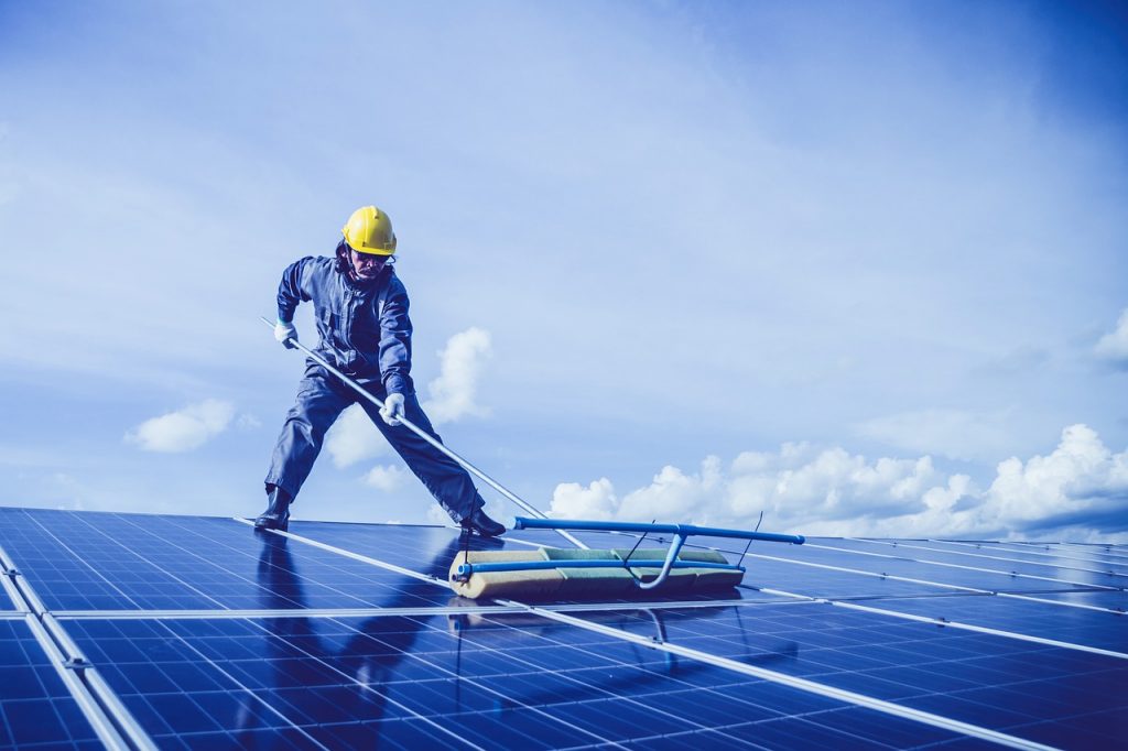 Man Solar Panel Rooftop Cleaning - maddybris / Pixabay